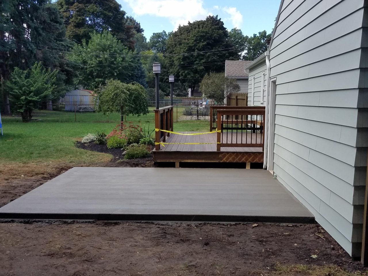 Backyard Patio by J & J Property Services